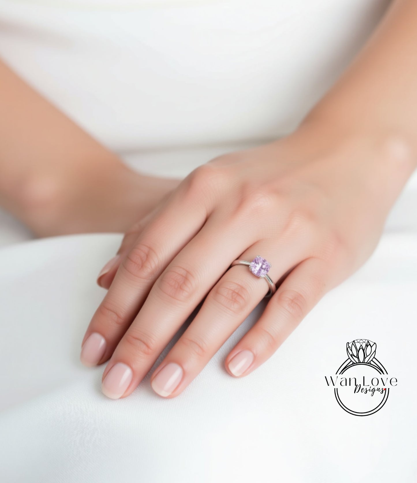 A close-up of a hand wearing a ring with a purple gemstone.