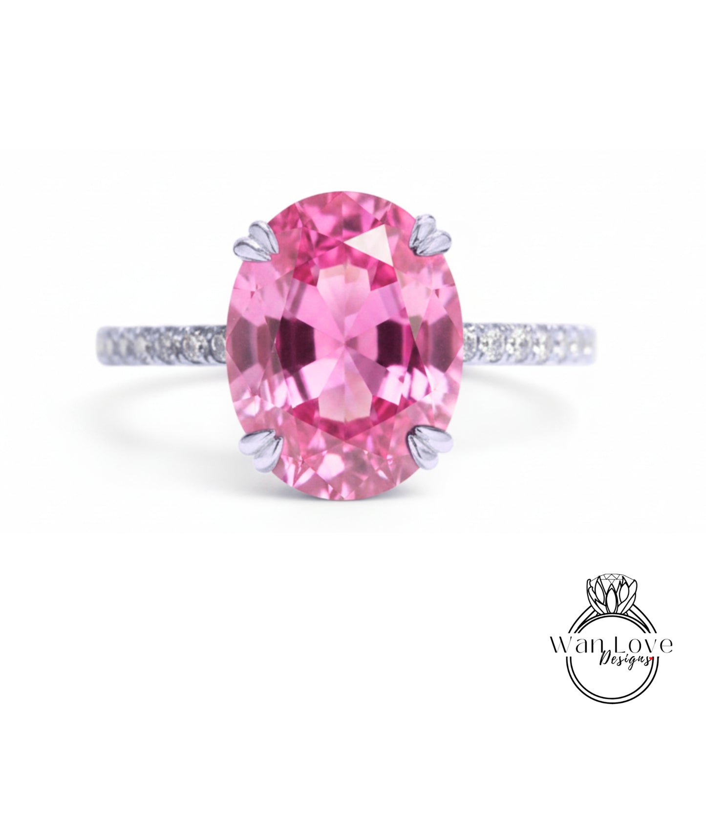 A pink gemstone ring with a large oval-shaped gemstone set in a silver band.