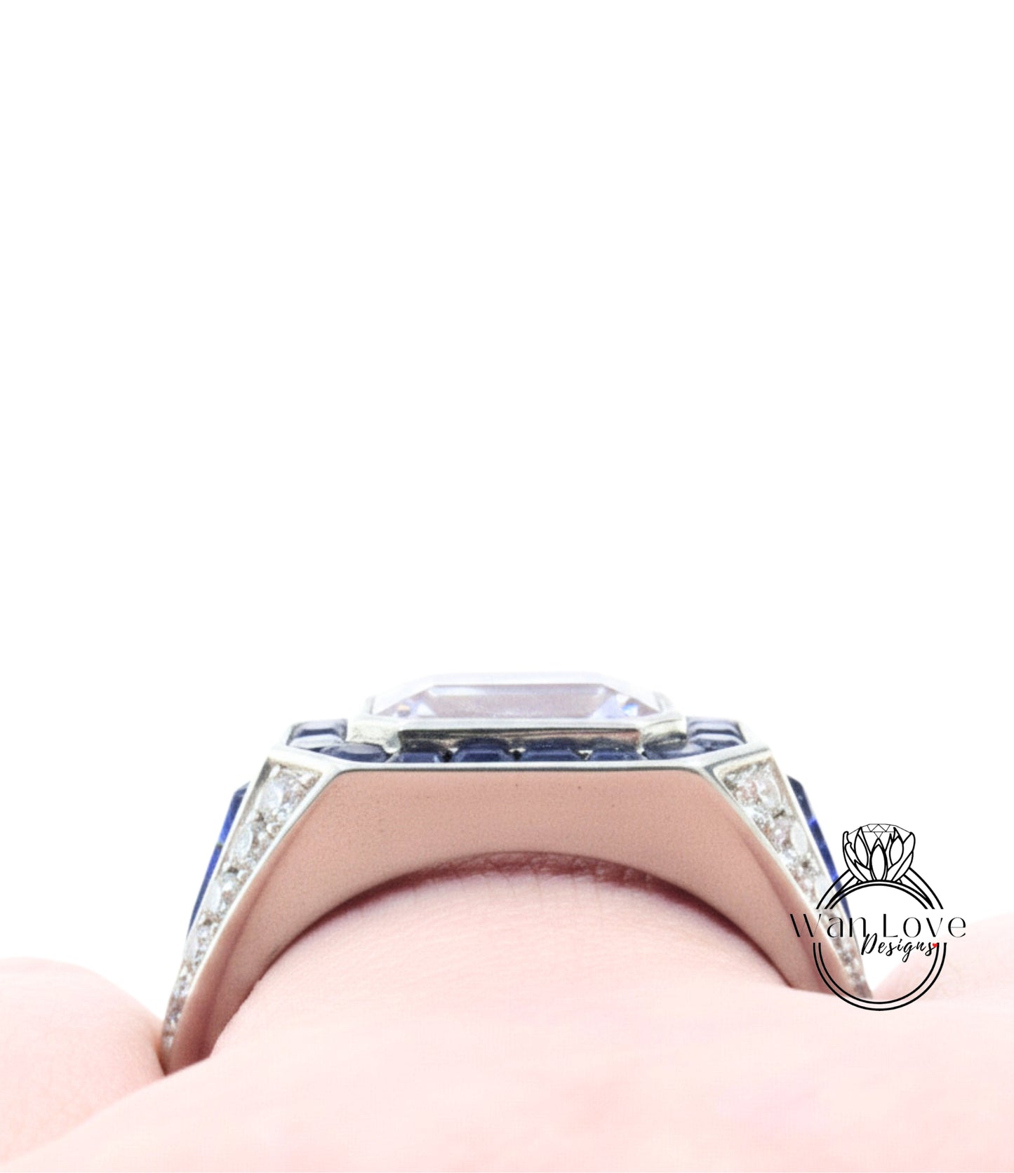 A close-up view of a diamond ring with a large central gemstone surrounded by smaller stones, set in a silver band.