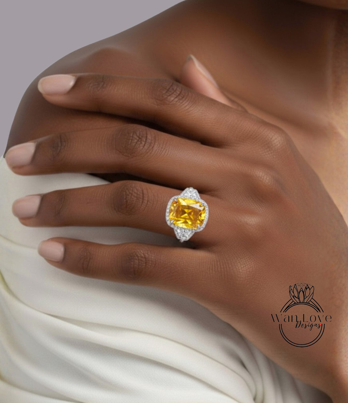 A close-up of a person's hand wearing a large, yellow gemstone ring with a diamond accent.