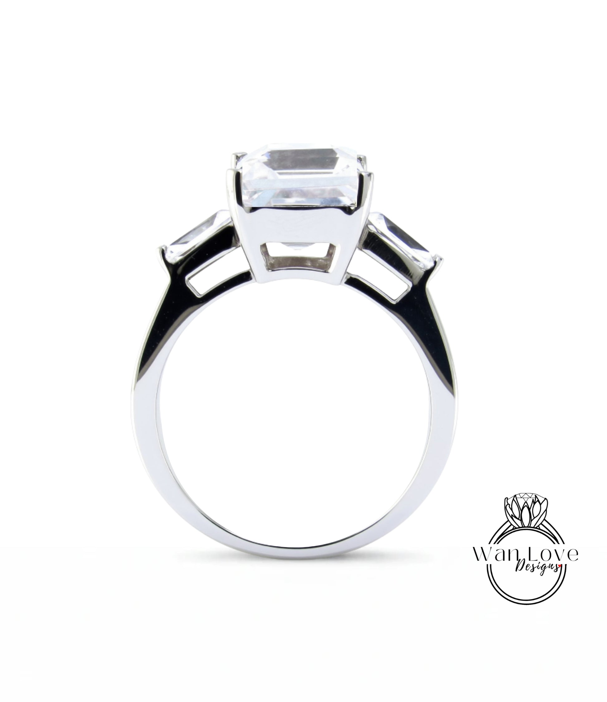 A silver ring with a large, clear gemstone set in the center.