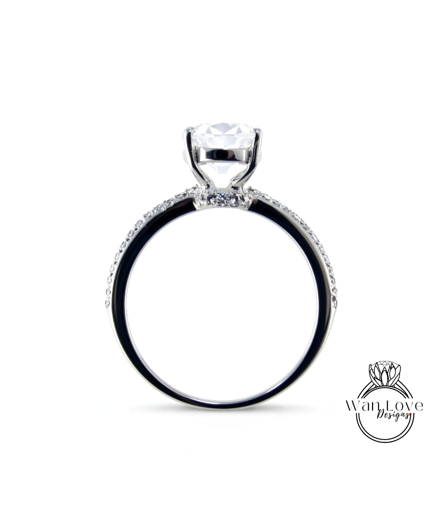 A silver engagement ring with a large central diamond and a halo of smaller diamonds around the band.