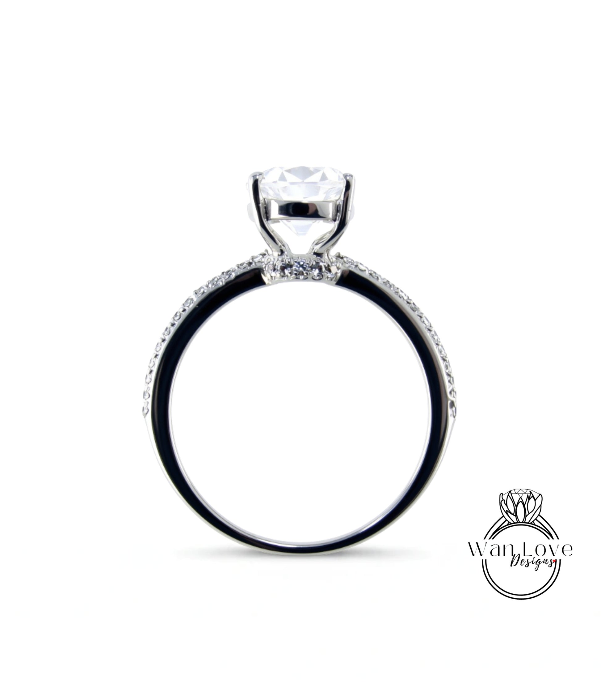 A silver engagement ring with a large central diamond and a halo of smaller diamonds around the band.