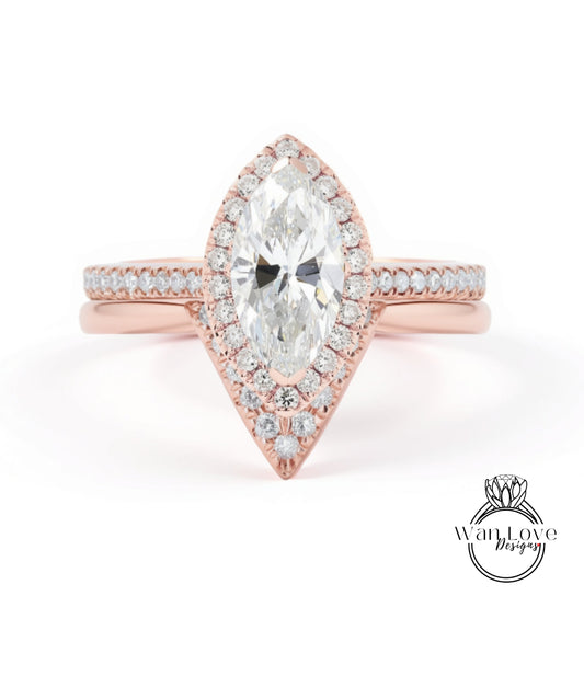 A beautiful engagement ring with a large oval-shaped diamond set in a halo of smaller diamonds, surrounded by a rose gold band.