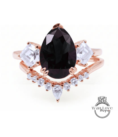 a beautiful rose gold ring with a large black gemstone at the center, surrounded by smaller clear gemstones.
