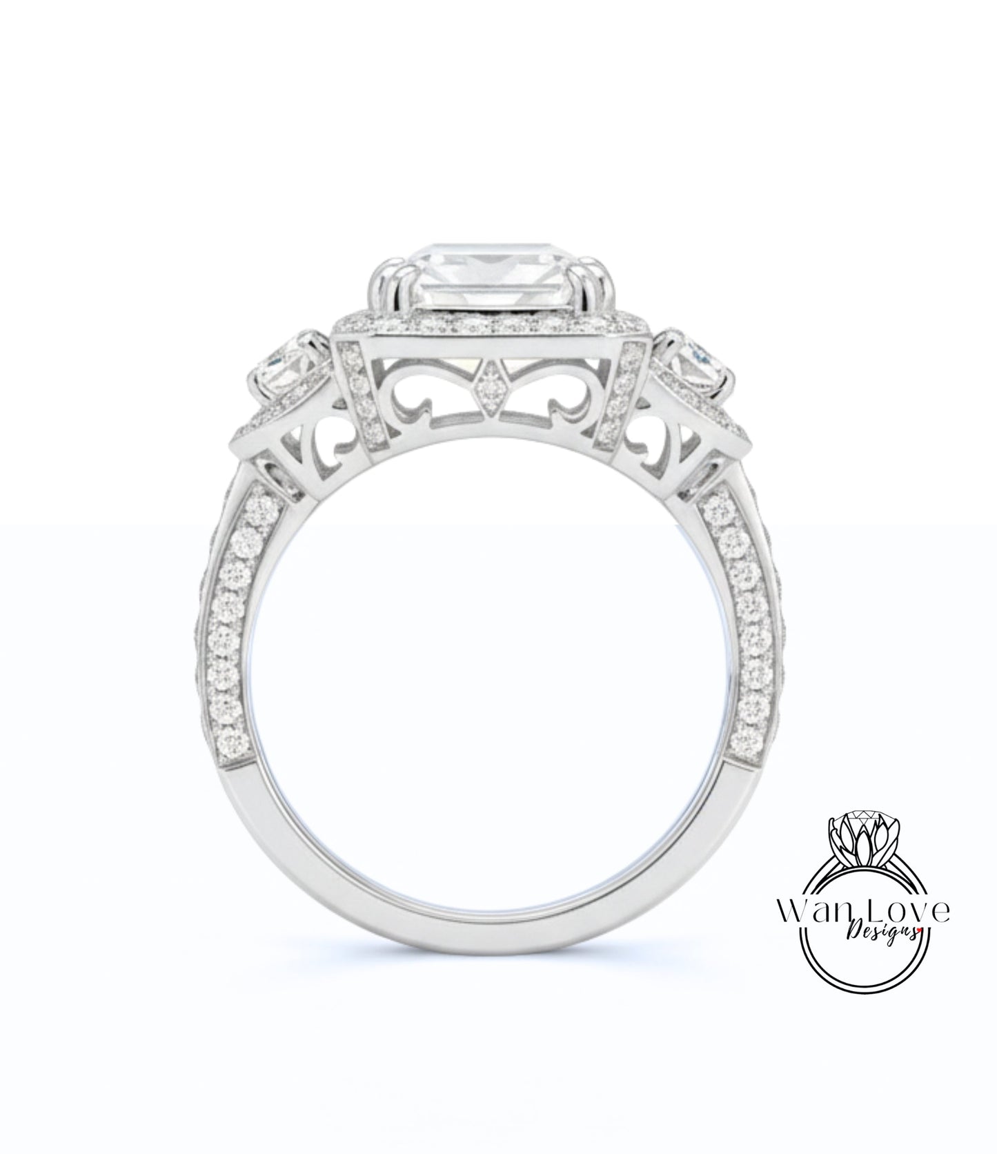 A close-up view of a silver engagement ring with a large central gemstone surrounded by smaller gemstones.