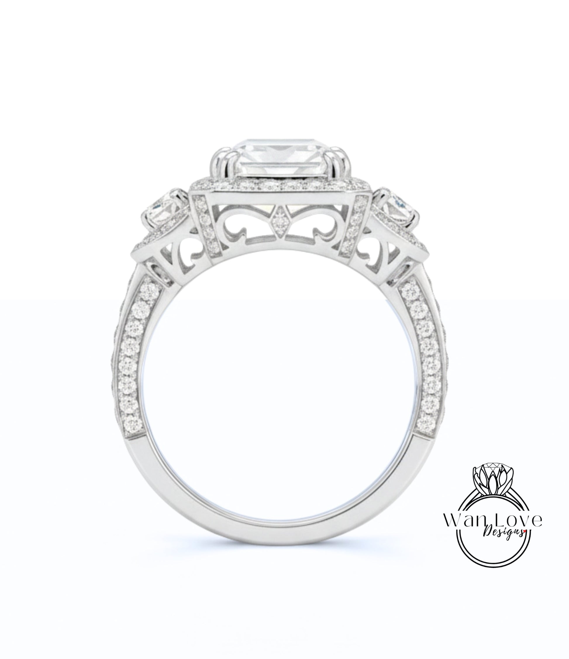 A close-up view of a silver engagement ring with a large central gemstone surrounded by smaller gemstones.
