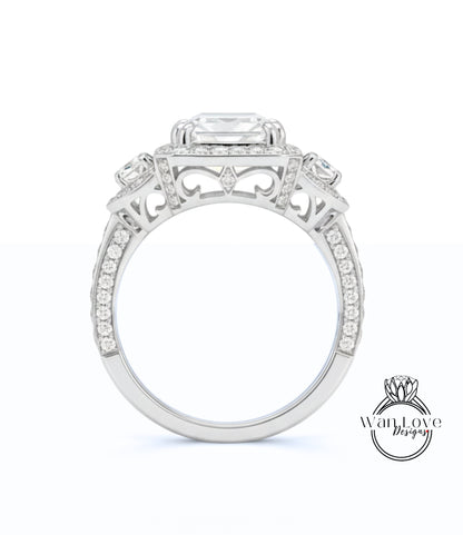 A close-up view of a silver engagement ring with a large central gemstone surrounded by smaller gemstones.