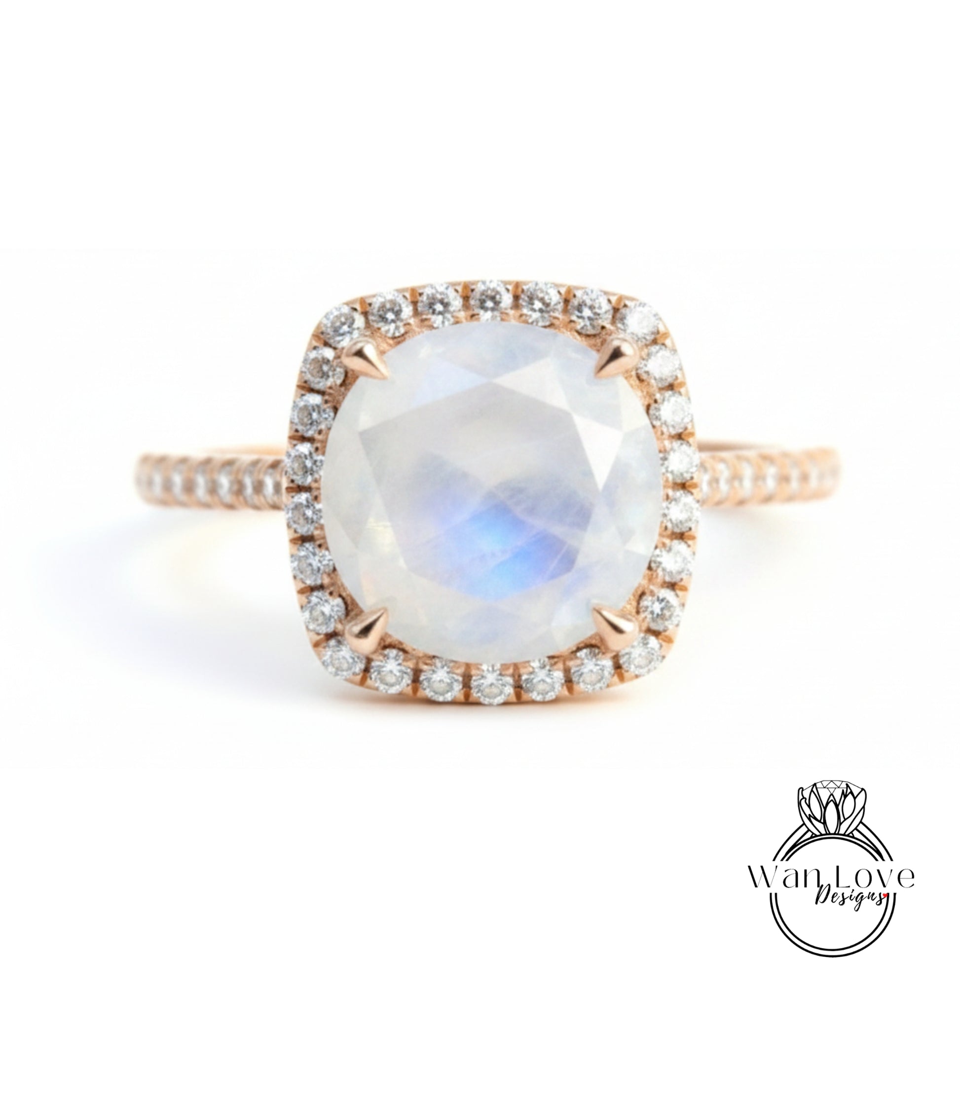 A beautiful engagement ring with a large oval-shaped gemstone surrounded by a halo of smaller diamonds.