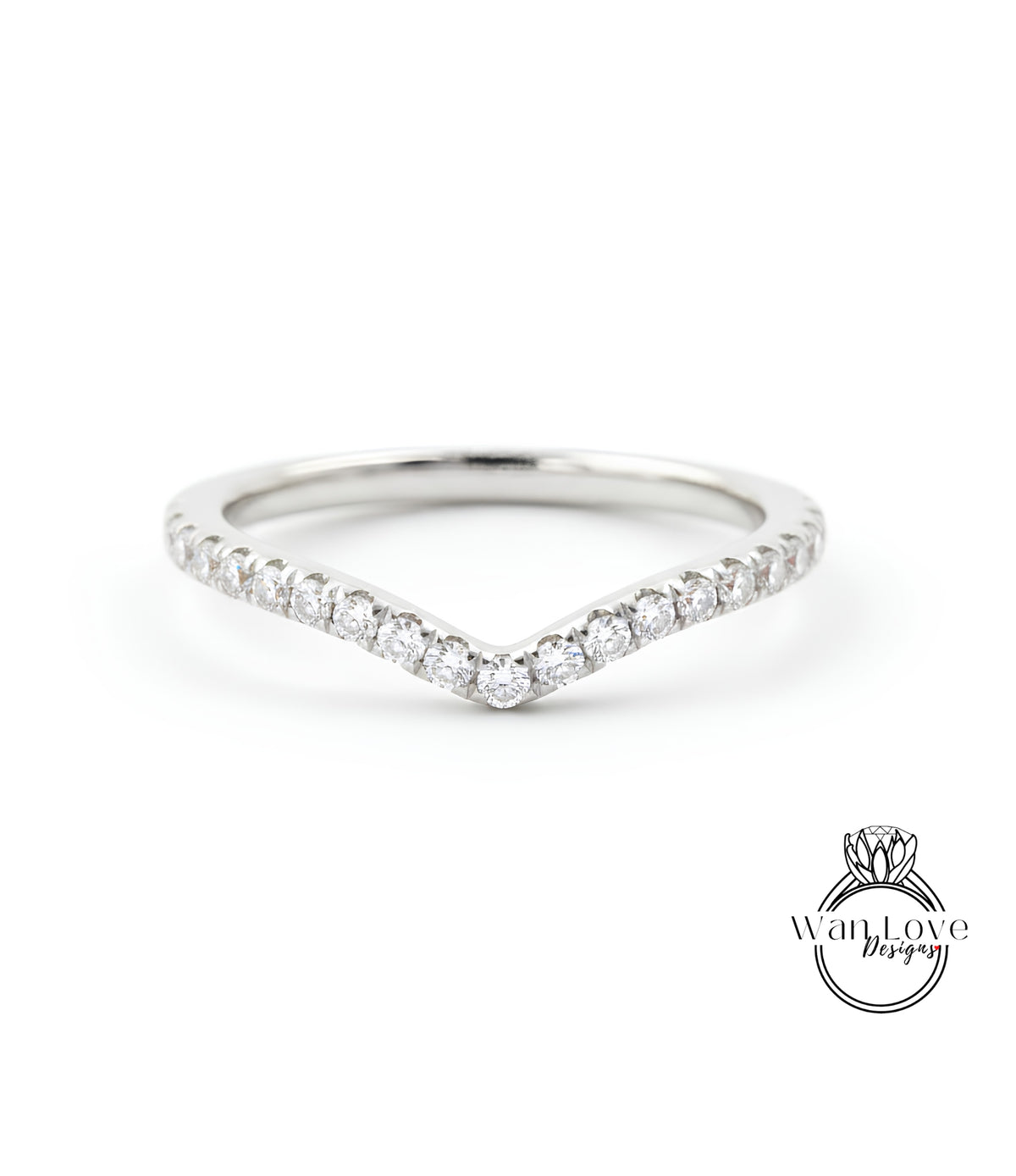 A silver ring with a v-shaped band and a row of small diamonds set in the center.