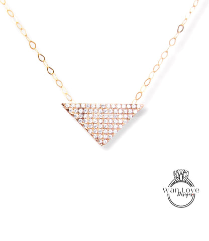 A necklace with a diamond-encrusted triangular pendant.