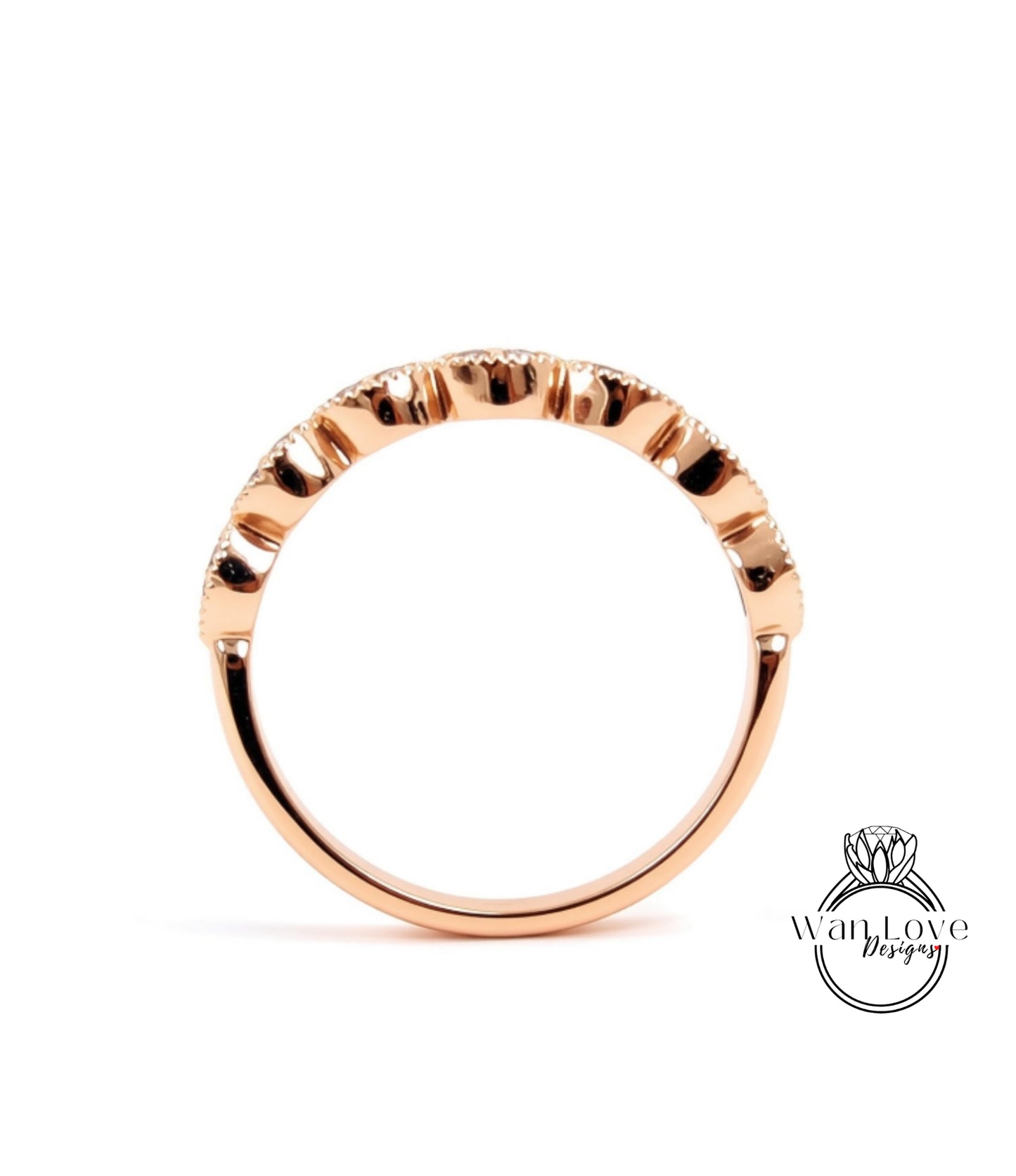 A rose gold ring with a unique, intricate design.