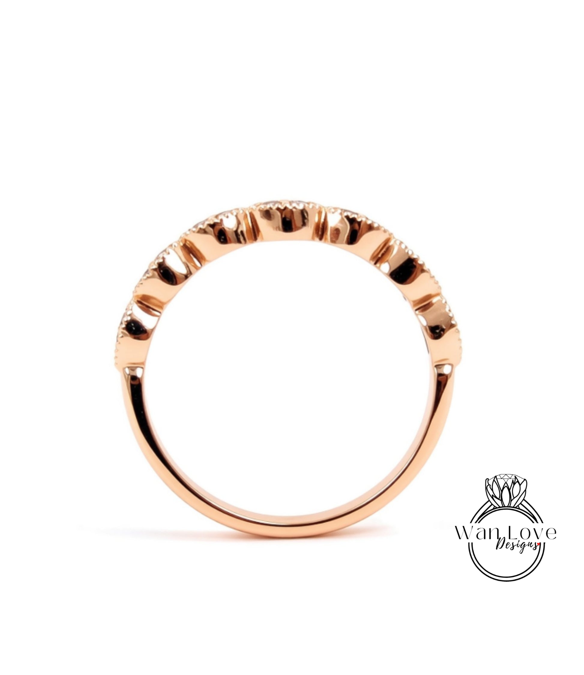 A rose gold ring with a unique, intricate design.