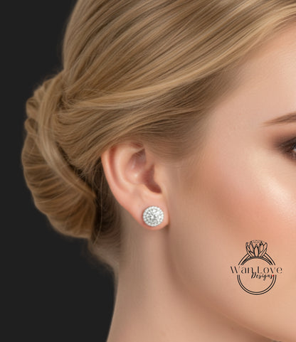 A close-up of a woman's face, focusing on her earrings and hair.
