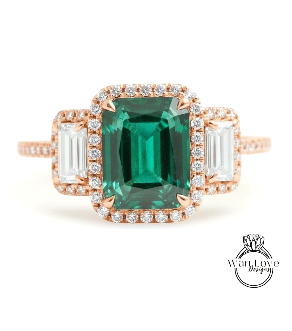 A rose gold ring with a large, green gemstone at the center, surrounded by smaller diamonds.
