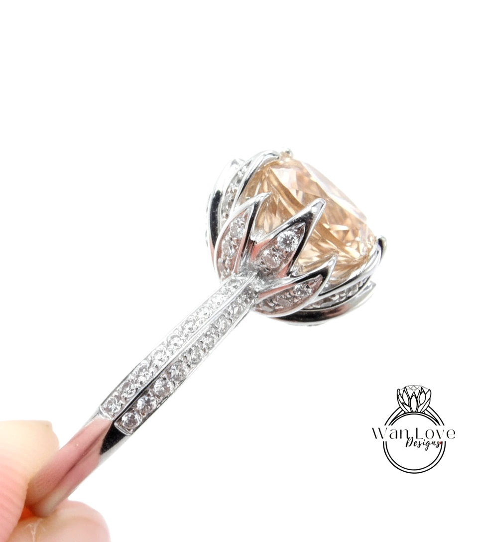 A close-up view of a diamond engagement ring with a large, round-cut diamond set in a silver band adorned with small diamonds.