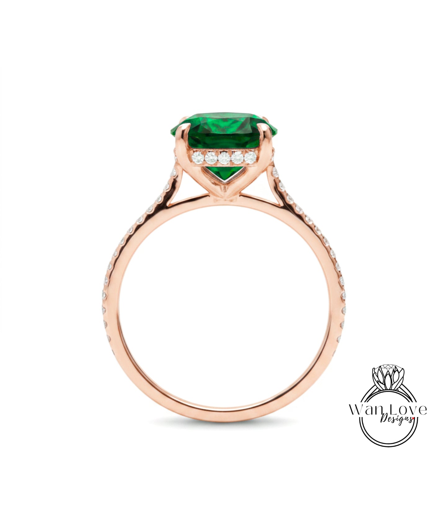 A rose gold engagement ring with a large green gemstone and small diamonds set in the band.