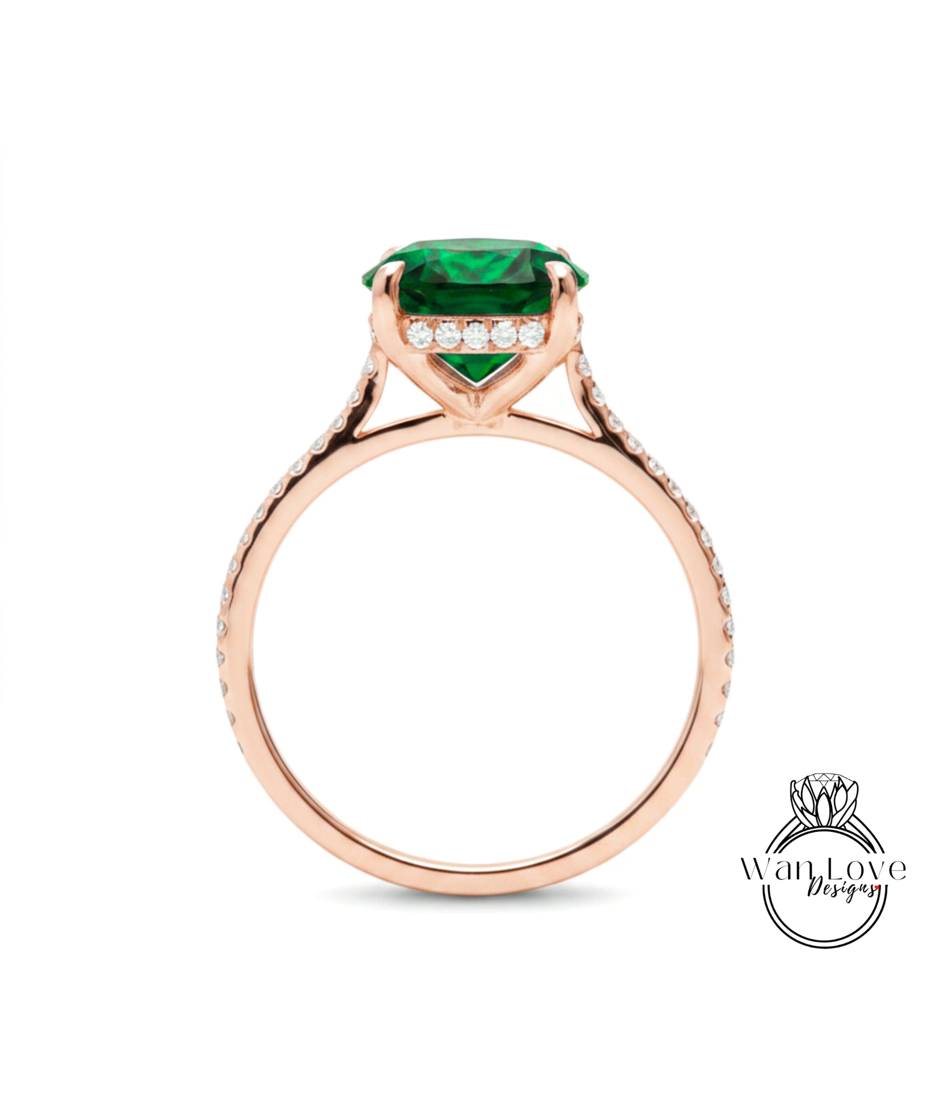 A rose gold engagement ring with a large green gemstone and small diamonds set in the band.