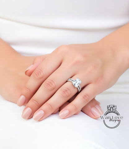 A close-up of a person's hand wearing a diamond engagement ring.
