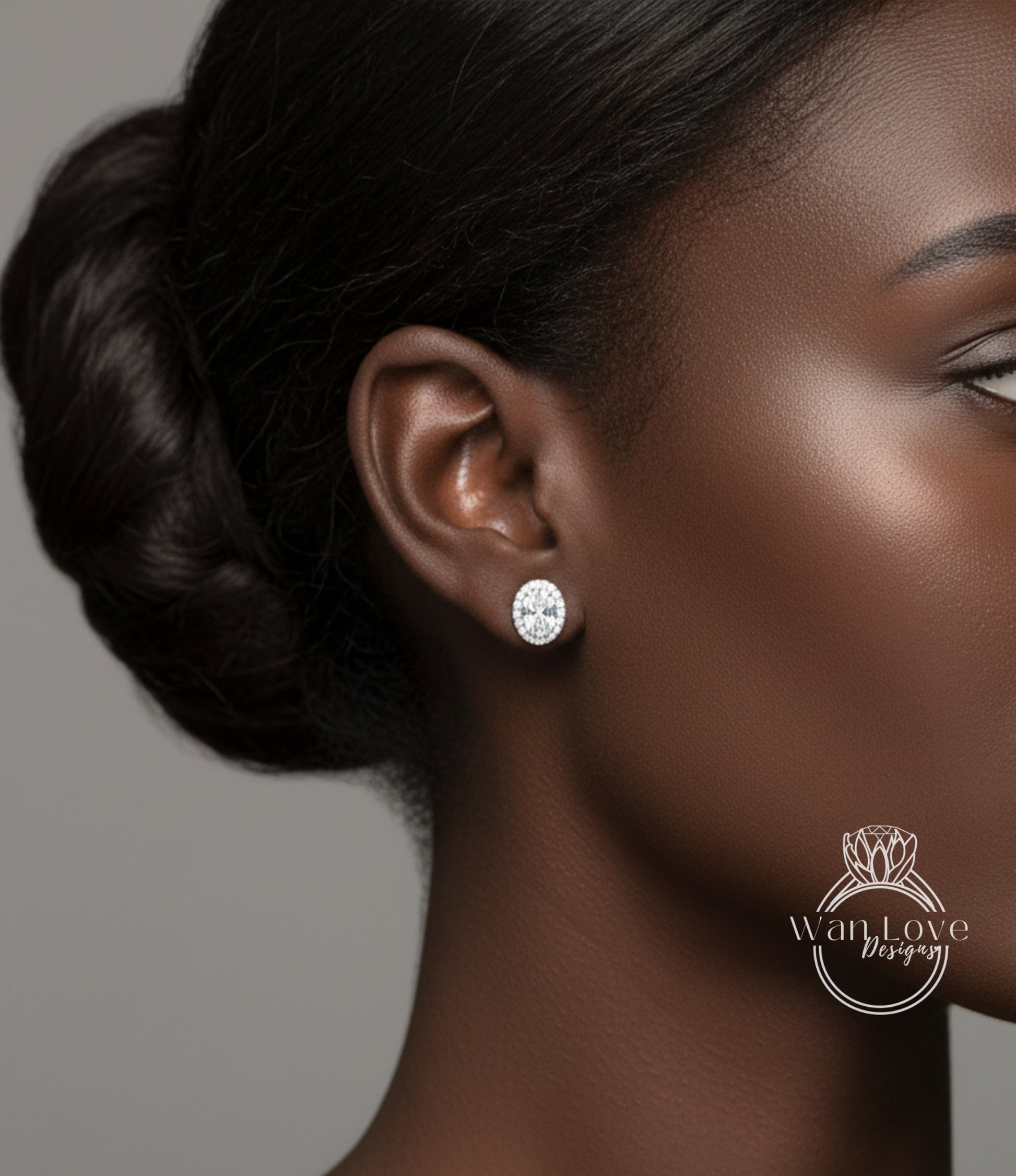 A close-up of a woman's face, focusing on her ear with a diamond earring.