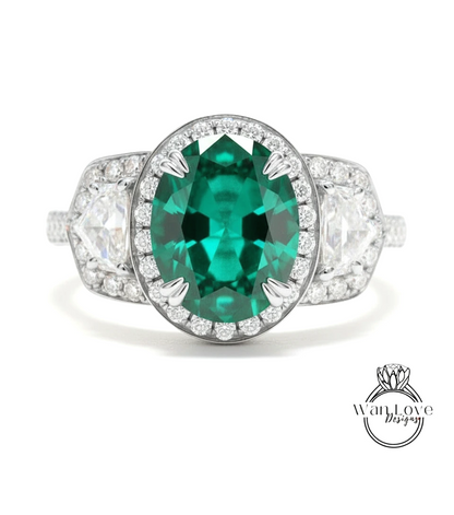 A stunning engagement ring with a large oval-shaped green gemstone surrounded by smaller diamonds, set in a silver band.