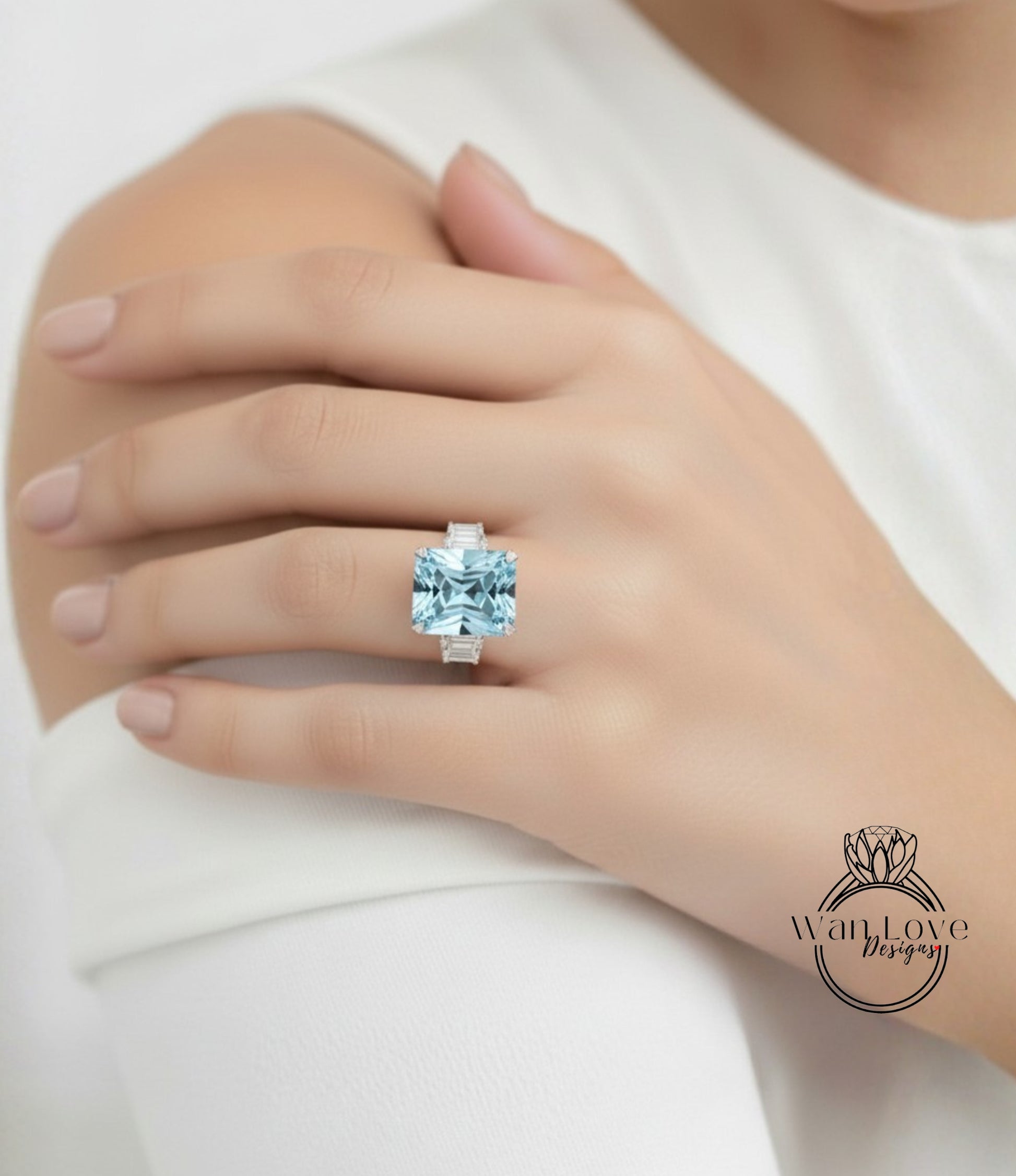 A close-up of a person's hand wearing a large, blue gemstone ring.