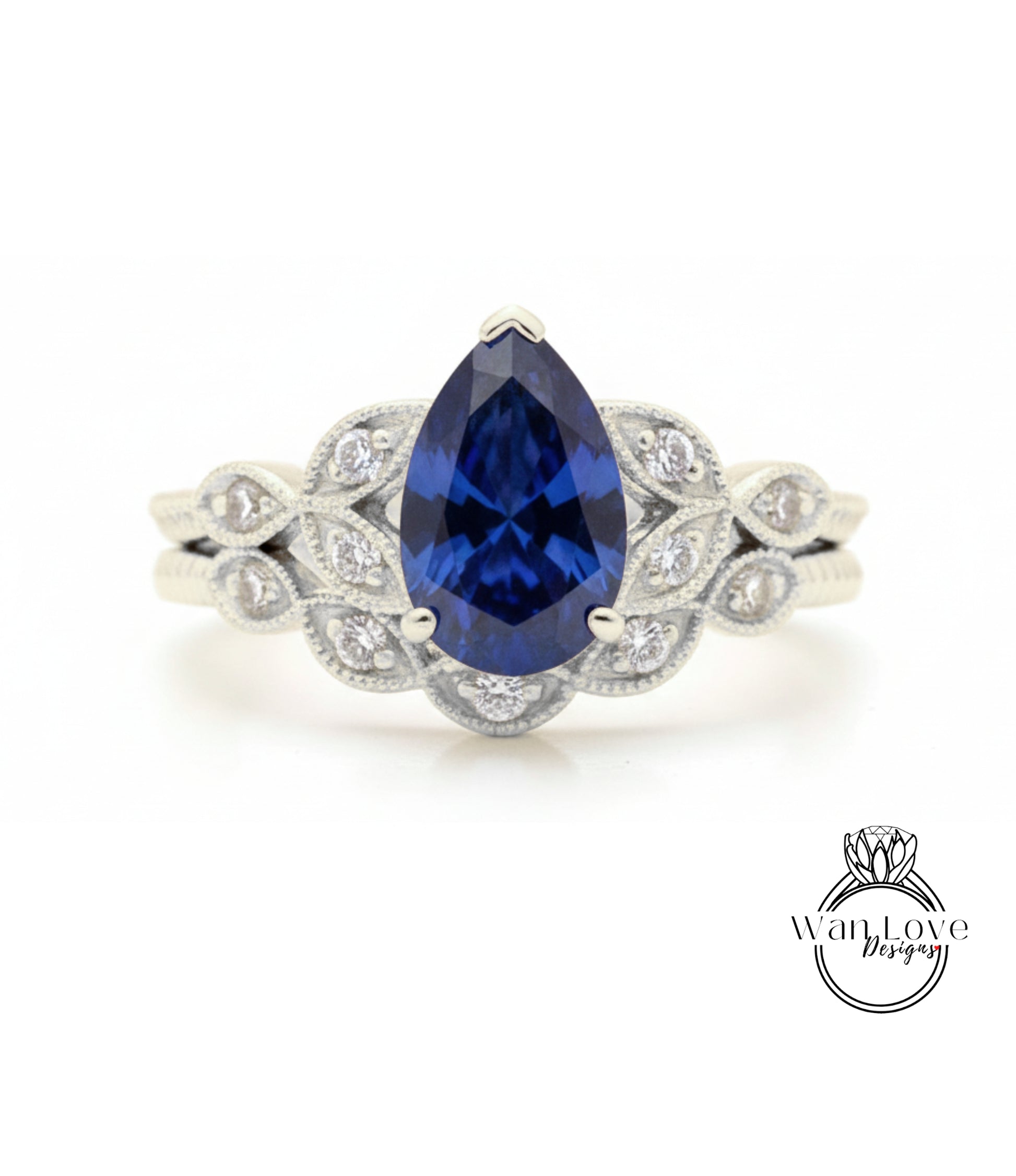 A close-up of a silver ring with a large blue gemstone, likely a sapphire, surrounded by smaller diamonds.