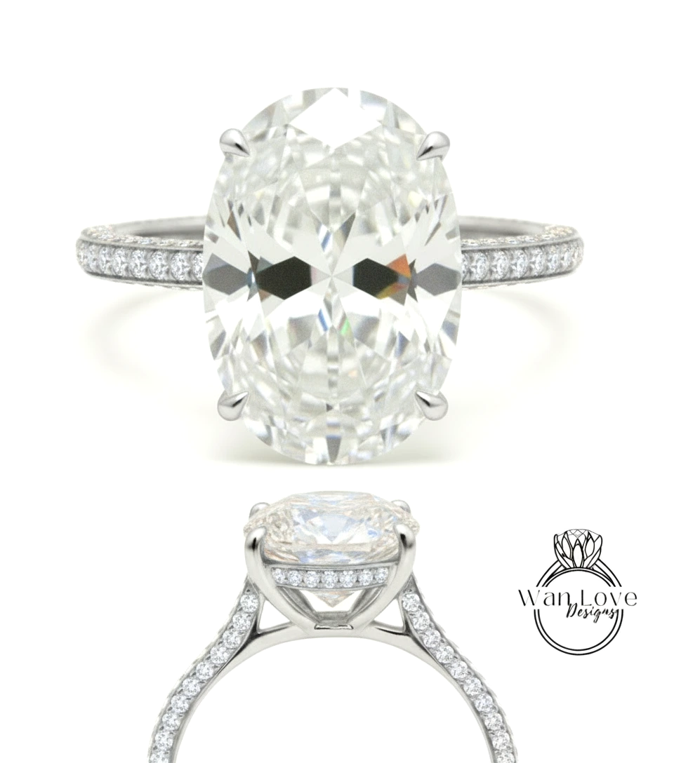 A large oval-shaped diamond engagement ring with a halo of smaller diamonds around the center stone.