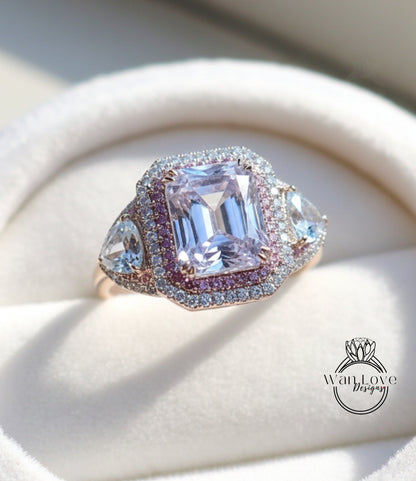 A close-up image of a beautiful engagement ring with a large, clear gemstone surrounded by smaller diamonds and set in a gold band.