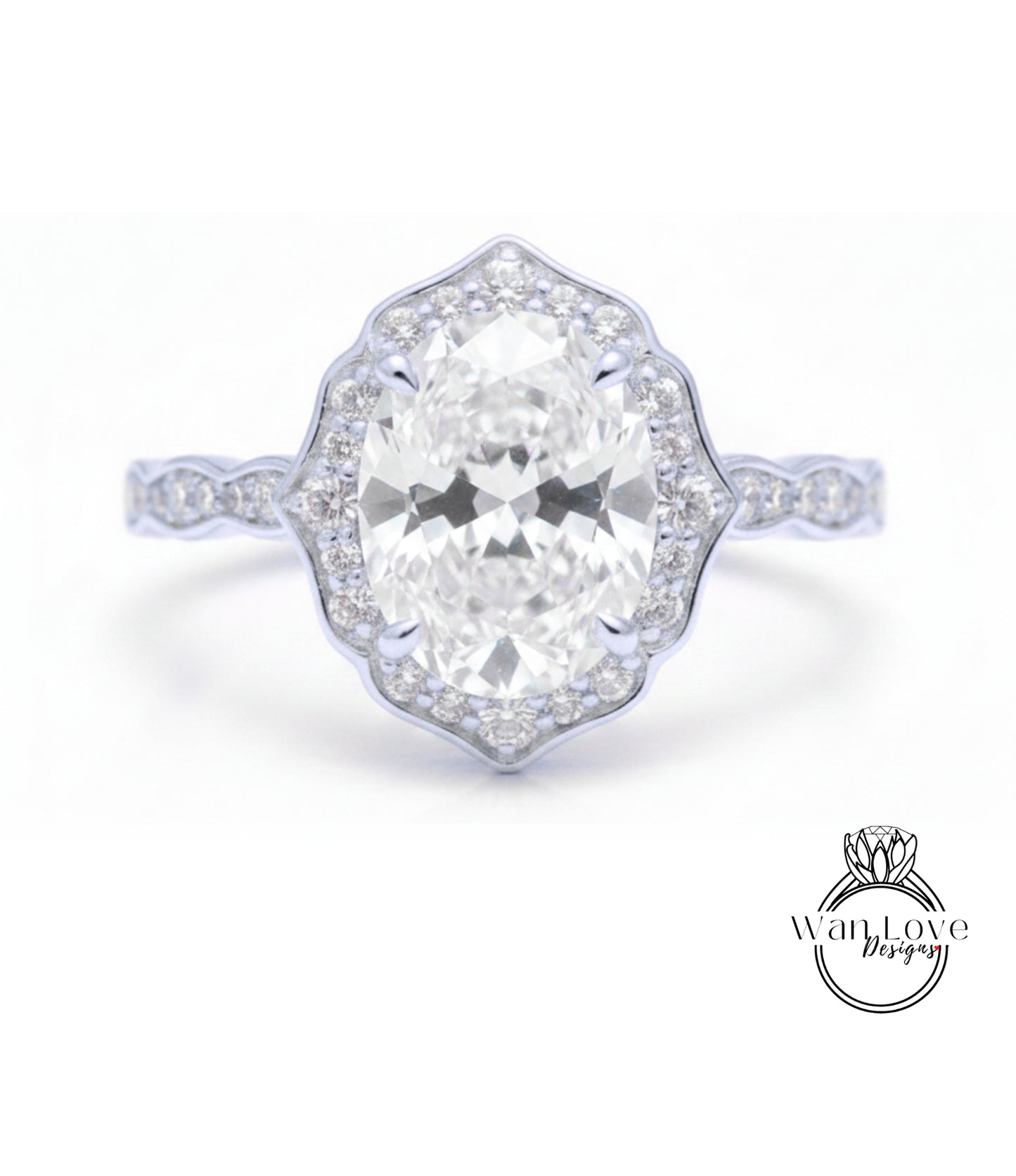 A close-up of a diamond engagement ring with a large oval-shaped diamond set in a halo of smaller diamonds.