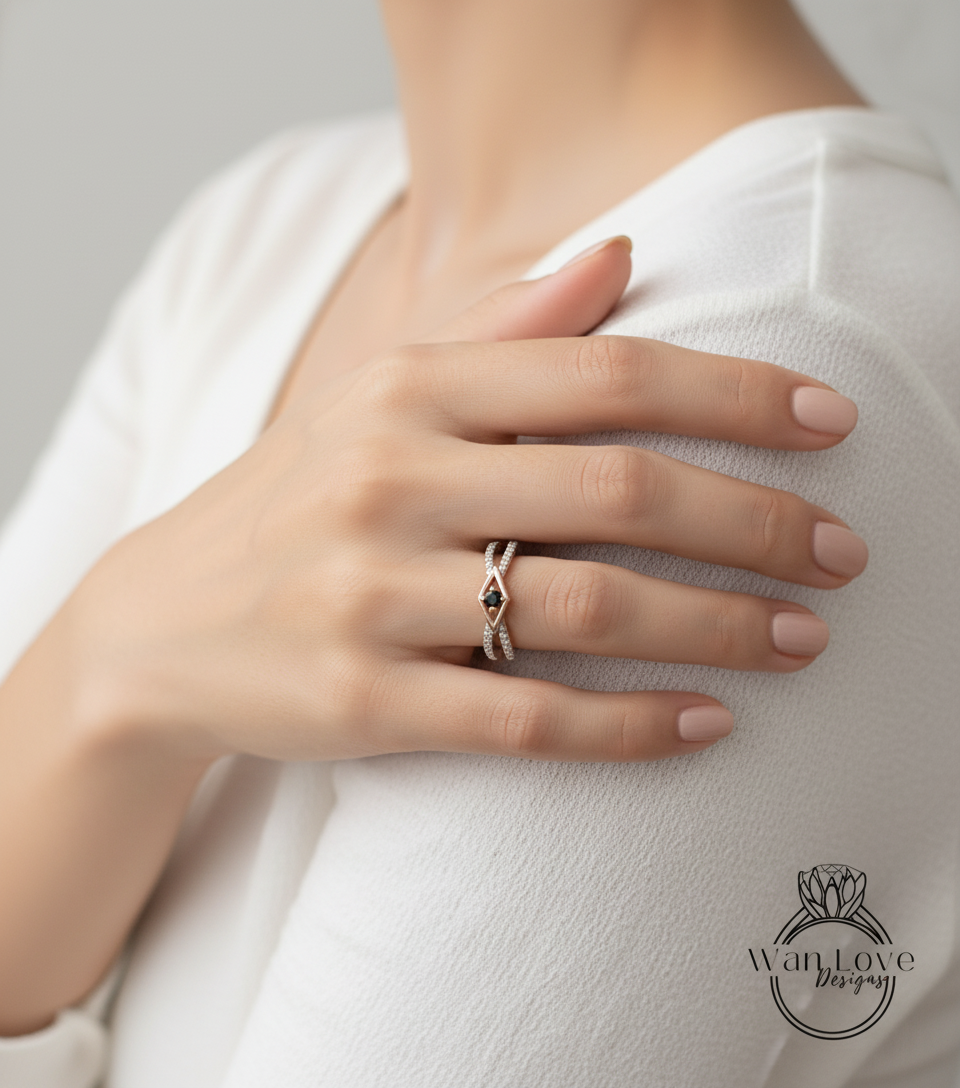 A close-up of a person's hand wearing a ring on their finger, with their hand resting on their shoulder.