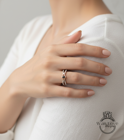 A close-up of a person's hand wearing a ring on their finger, with their hand resting on their shoulder.