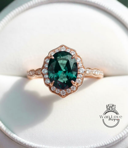 A close-up image of a rose gold ring with a large oval-shaped gemstone set in the center, surrounded by smaller diamonds.