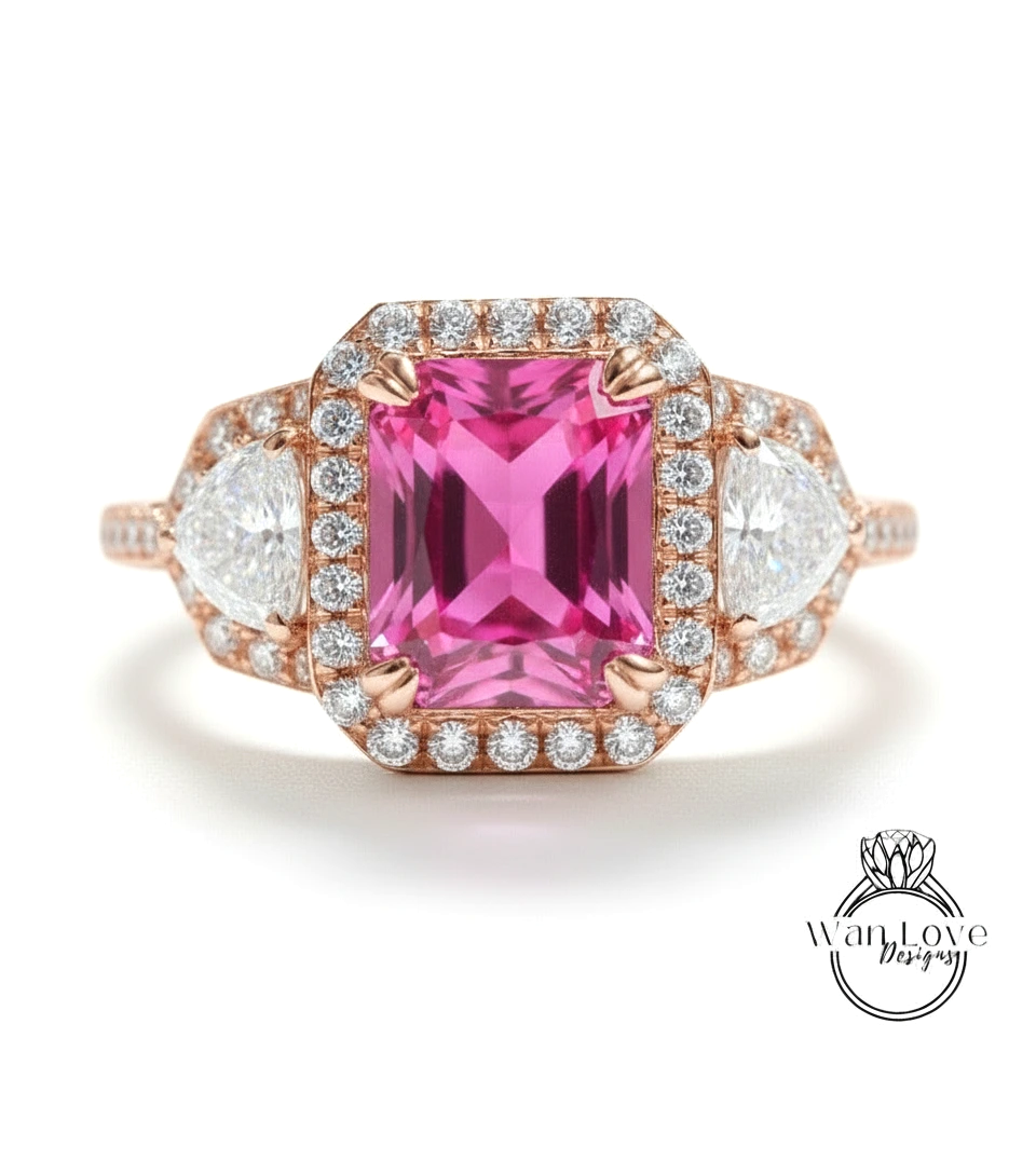 A pink gemstone engagement ring with a halo of diamonds around it, showcasing the ring's intricate design and sparkling gemstones.
