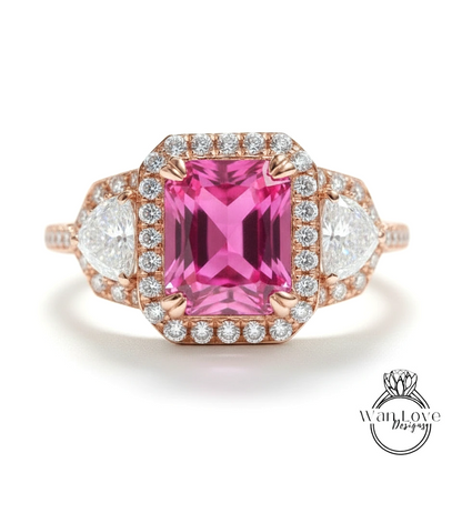 A pink gemstone engagement ring with a halo of diamonds around it, showcasing the ring's intricate design and sparkling gemstones.