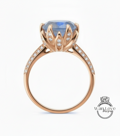 A gold ring with a large blue gemstone, possibly a sapphire, set in a decorative flower-like design.