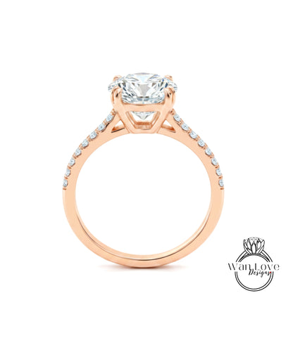 A close-up of a rose gold engagement ring with a large, round diamond set in the center.