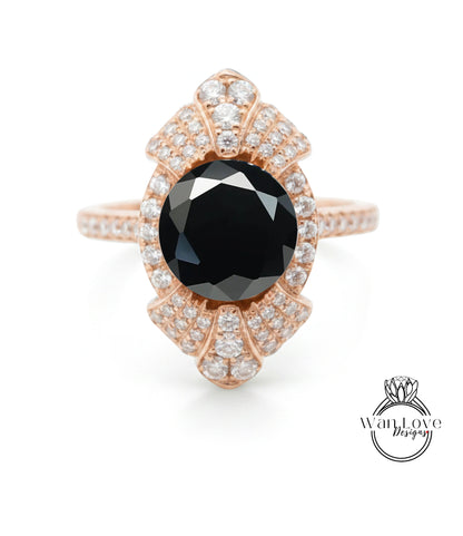 a beautiful rose gold ring with a large black diamond as the centerpiece.
