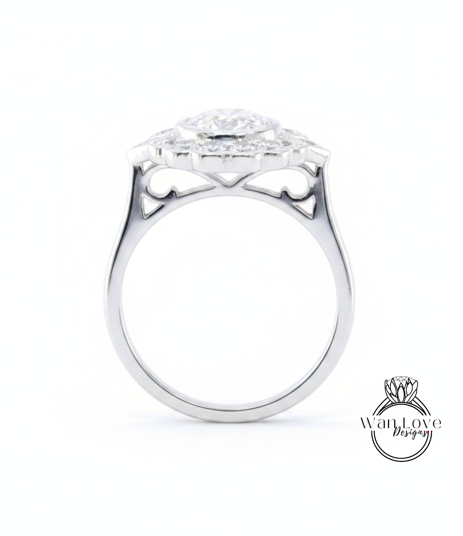 A silver ring with a large central diamond surrounded by smaller diamonds, showcasing intricate metalwork and design.