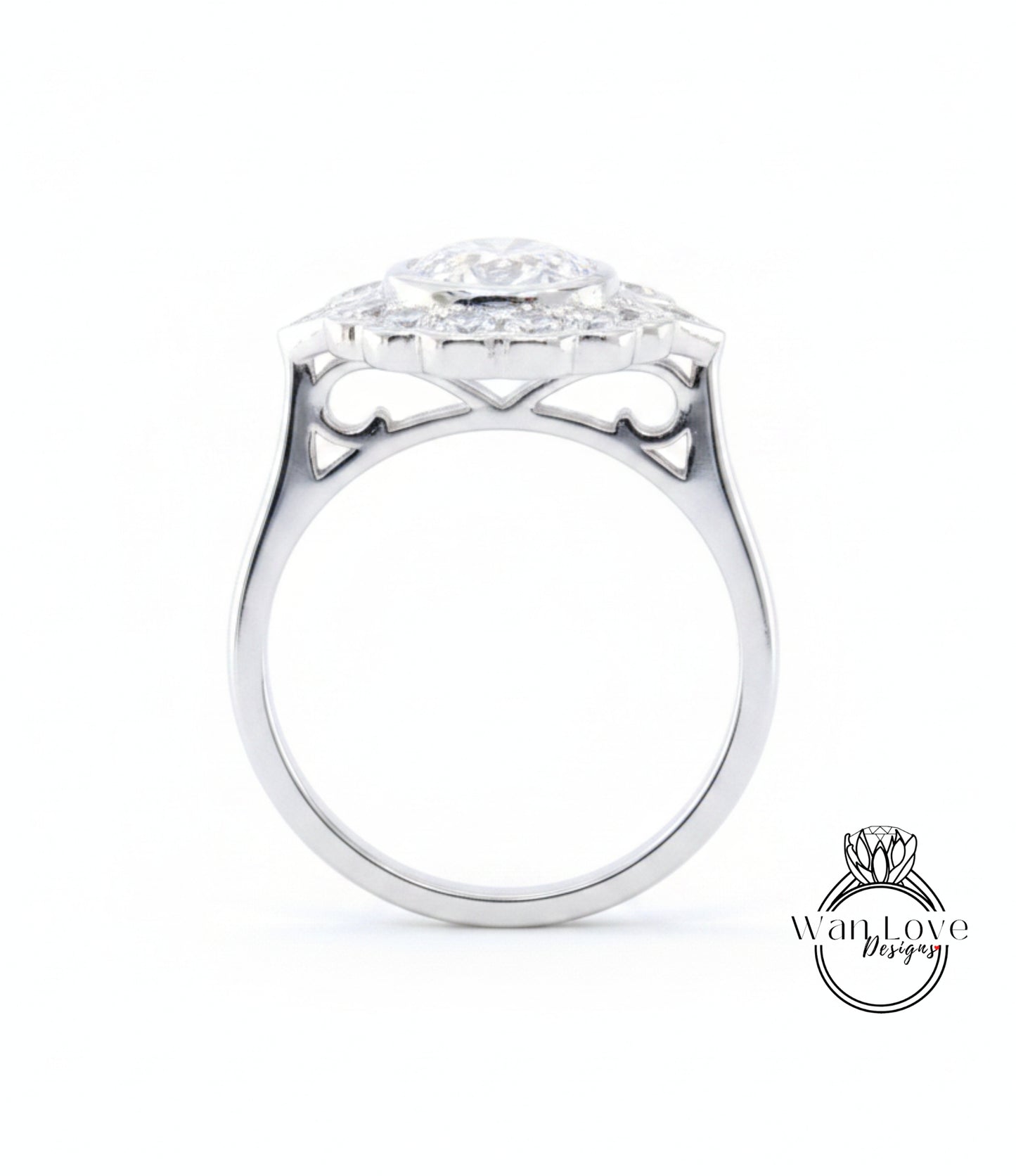 A silver ring with a large central diamond surrounded by smaller diamonds, showcasing intricate metalwork and design.
