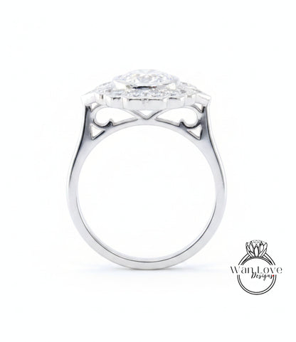 A silver ring with a large central diamond surrounded by smaller diamonds, showcasing intricate metalwork and design.