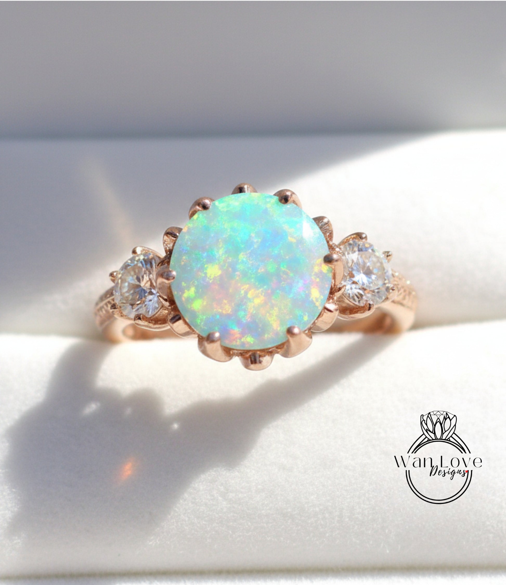 A gold ring with a large oval opal stone set in the center, surrounded by smaller diamonds.