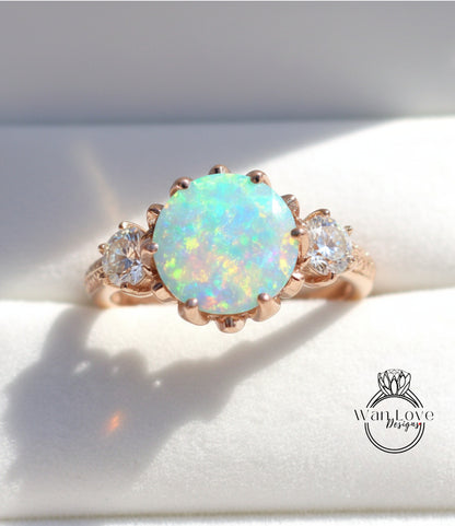 A gold ring with a large oval opal stone set in the center, surrounded by smaller diamonds.