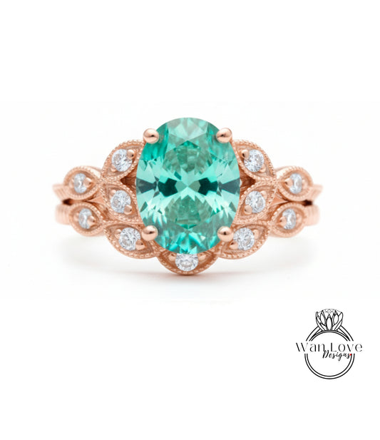 a beautiful ring with a large oval-shaped gemstone surrounded by smaller diamonds.