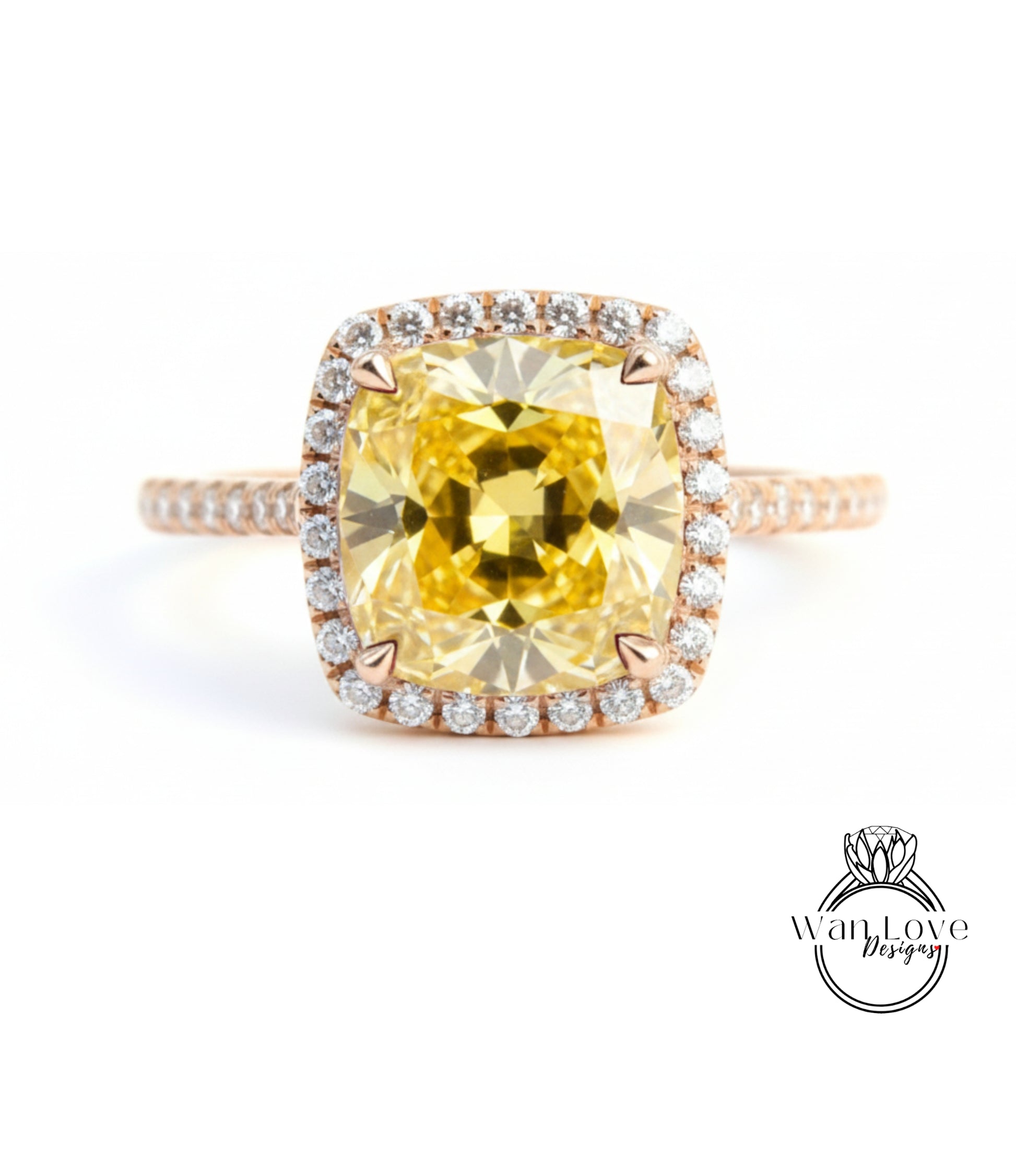 A large yellow diamond ring with a halo of smaller diamonds around the center stone.