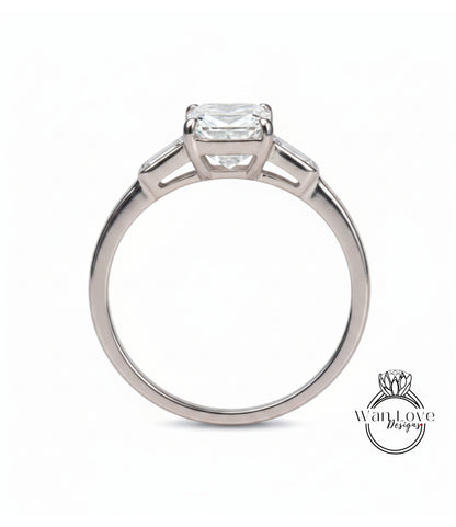 A silver engagement ring with a large diamond set in the center.