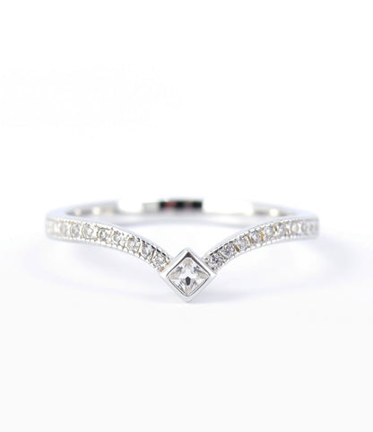A silver ring with a diamond-encrusted band and a central square-shaped diamond.