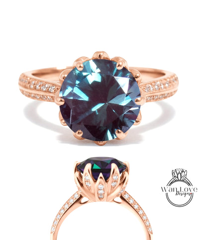 a large, blue gemstone ring with a rose gold band and small diamonds.