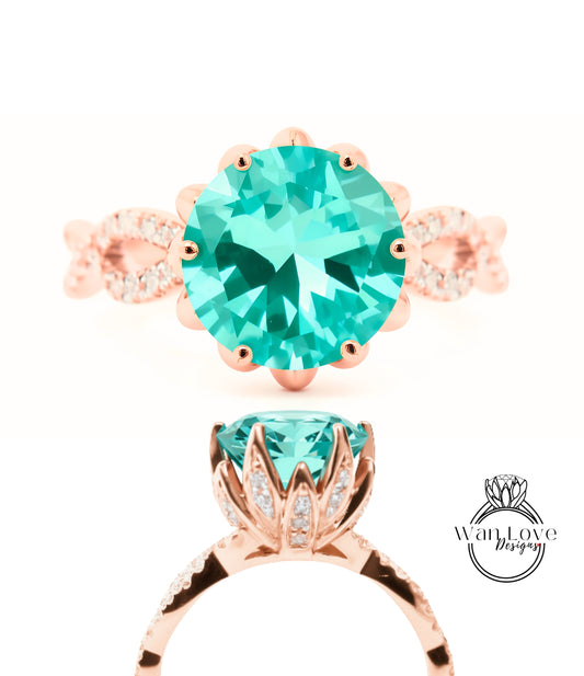 a beautiful turquoise gemstone ring with a delicate rose gold band adorned with small diamonds.