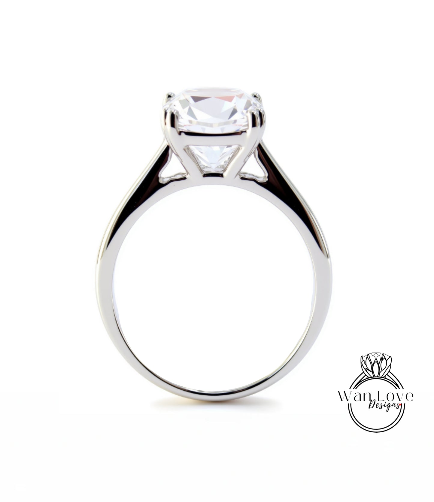 A silver engagement ring with a large, clear gemstone set in the center of the band.